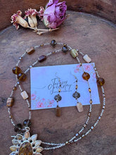 Load image into Gallery viewer, Agate Pendant flower necklace in natural colors of brown and green, hanging at 36” with Earrings.