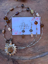 Load image into Gallery viewer, Agate Pendant flower necklace in natural colors of brown and green, hanging at 36” with Earrings.