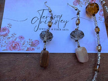 Load image into Gallery viewer, Agate Pendant flower necklace in natural colors of brown and green, hanging at 36” with Earrings.