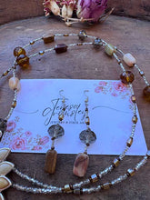 Load image into Gallery viewer, Agate Pendant flower necklace in natural colors of brown and green, hanging at 36” with Earrings.