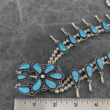 Load image into Gallery viewer, Squash Blossom necklace and earring set inlaid with turquoise next to rules showing nala as 2.5&quot;
