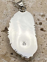 Load image into Gallery viewer, Back of sterling silver pendant showing artist initials and sterling silver marking.