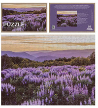Load image into Gallery viewer, John Fielder puzzle box with picture of mountain and wildflowers.