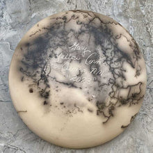 Load image into Gallery viewer, Bottom of horsehair round pot hade etched with traditional Acoma designs showign artist signature.