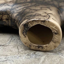 Load image into Gallery viewer, Horeshair pottery bison figure with artist signature etched in bottom.