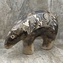 Acoma horsehair bear figurine with traditional Acoma etchings.