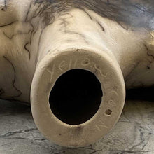 Bottom of Acoma horsehair bear figurine with traditional Acoma etchings showign artist signature.