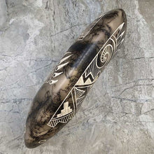 Acoma horsehair bear figurine with traditional Acoma etchings.