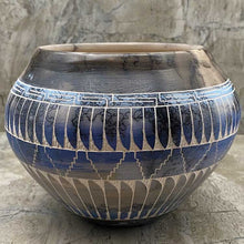 Hand etched pottery with dream catcher inlay.