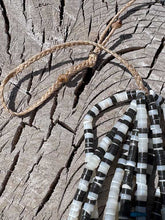 Load image into Gallery viewer, Pictured is a 10 strand beaded necklace with Kingman Turquoise nuggets and Mother of Pearl Heishi Stones.