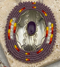 Load image into Gallery viewer, Ute beaded necklace with sterling silver plate with hand etched designs and a purple agate cabochon medallion.
