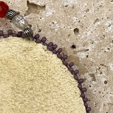 Load image into Gallery viewer, Ute beaded necklace with suede medallion backing.
