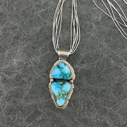 Sterling silver and Sonoran Gold turquoise pendant on six-strand silver necklace