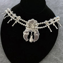 Load image into Gallery viewer, Back of Squash Blossom necklace showing signature of artist.
