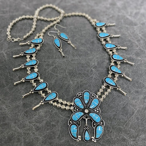 Squash Blossom necklace and earring set inlaid with turquoise.