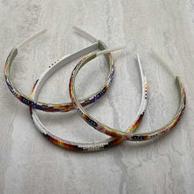 Load image into Gallery viewer, Stack of three Ute beaded headbands.
