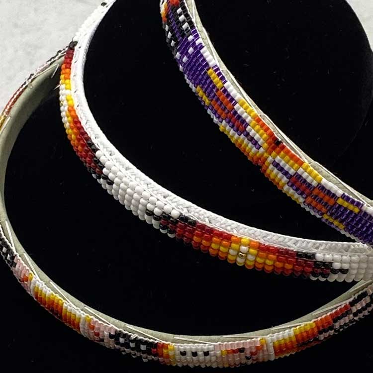 Stack of three Ute beaded headbands.