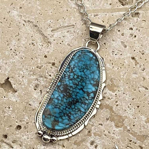 Turquoise and sterling silver pendant and chain.