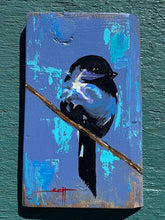 Load image into Gallery viewer, A painting of a black and blue bird perched on a branch against a textured blue and teal background.
