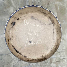 Load image into Gallery viewer, Bottom of hand etched pottery vase with dream catcher inlay showing artist signature.
