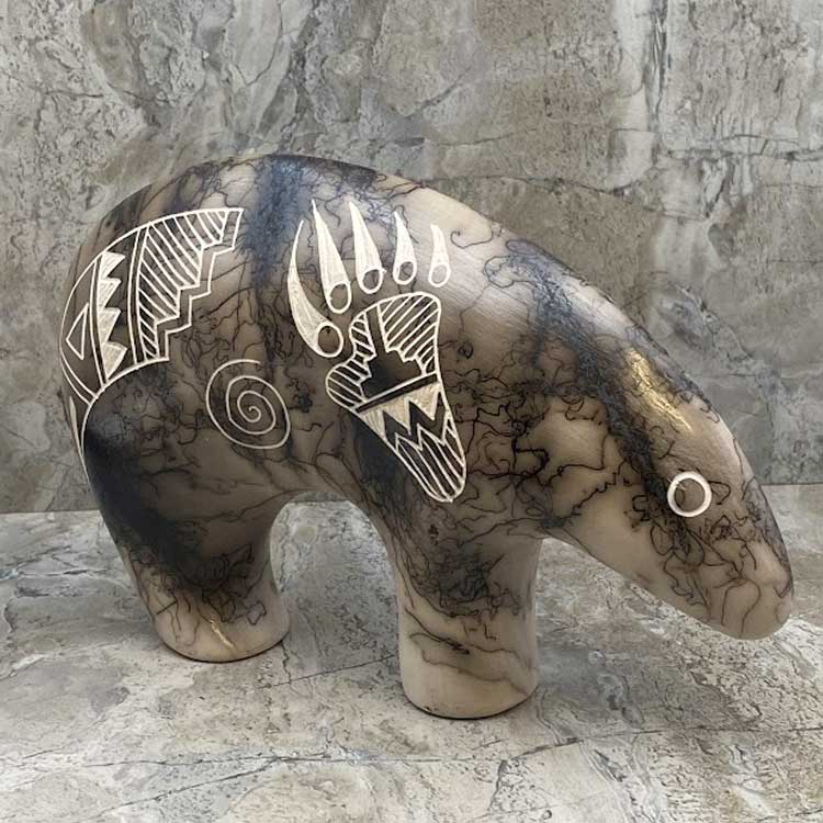 Acoma horsehair bear figurine with traditional Acoma etchings.