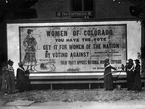 Black and white historical photo and Vintage Colorado Womenâ€™s Suffrage poster of a famous suffrage billboard circa 1910-1920 for women's rights from the History Colorado Collection